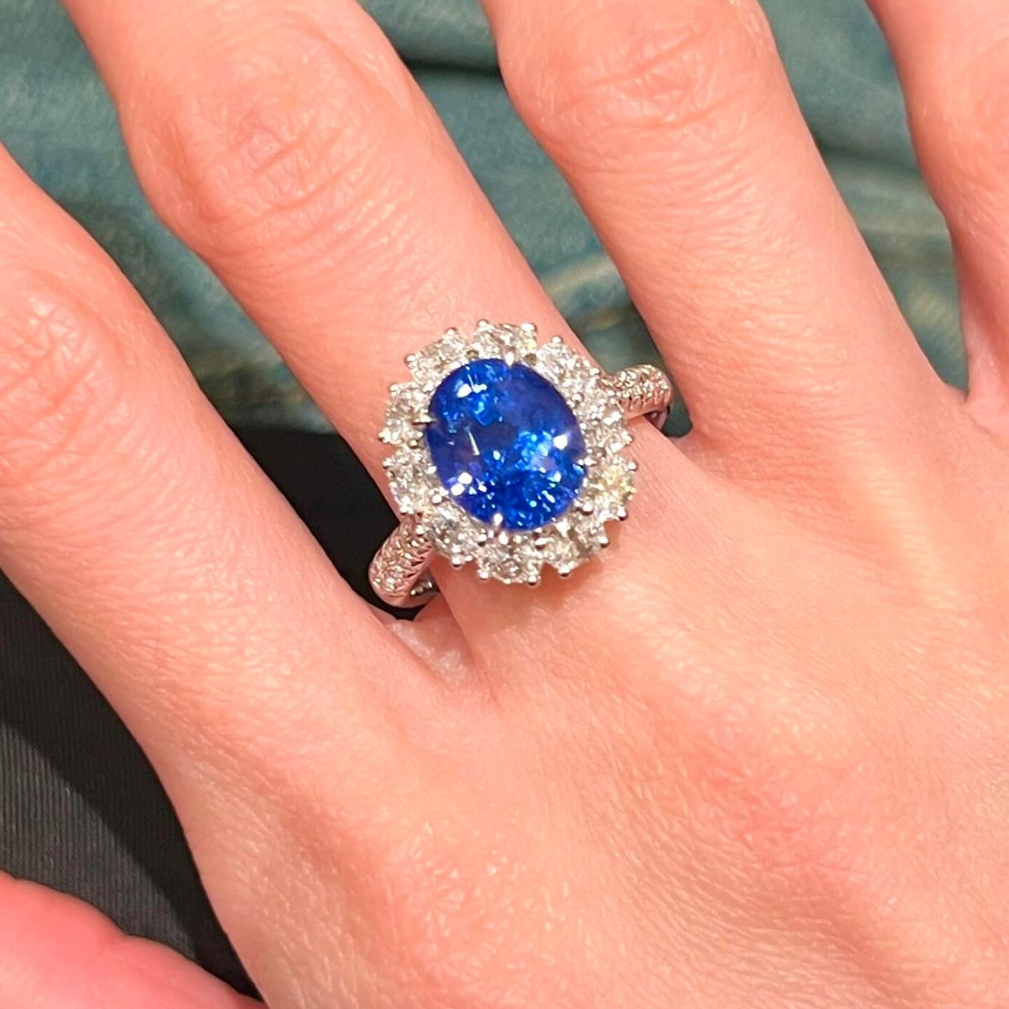 Oval Blue Sapphire & Diamond Halo Ring | Twisted Band Engagement Ring