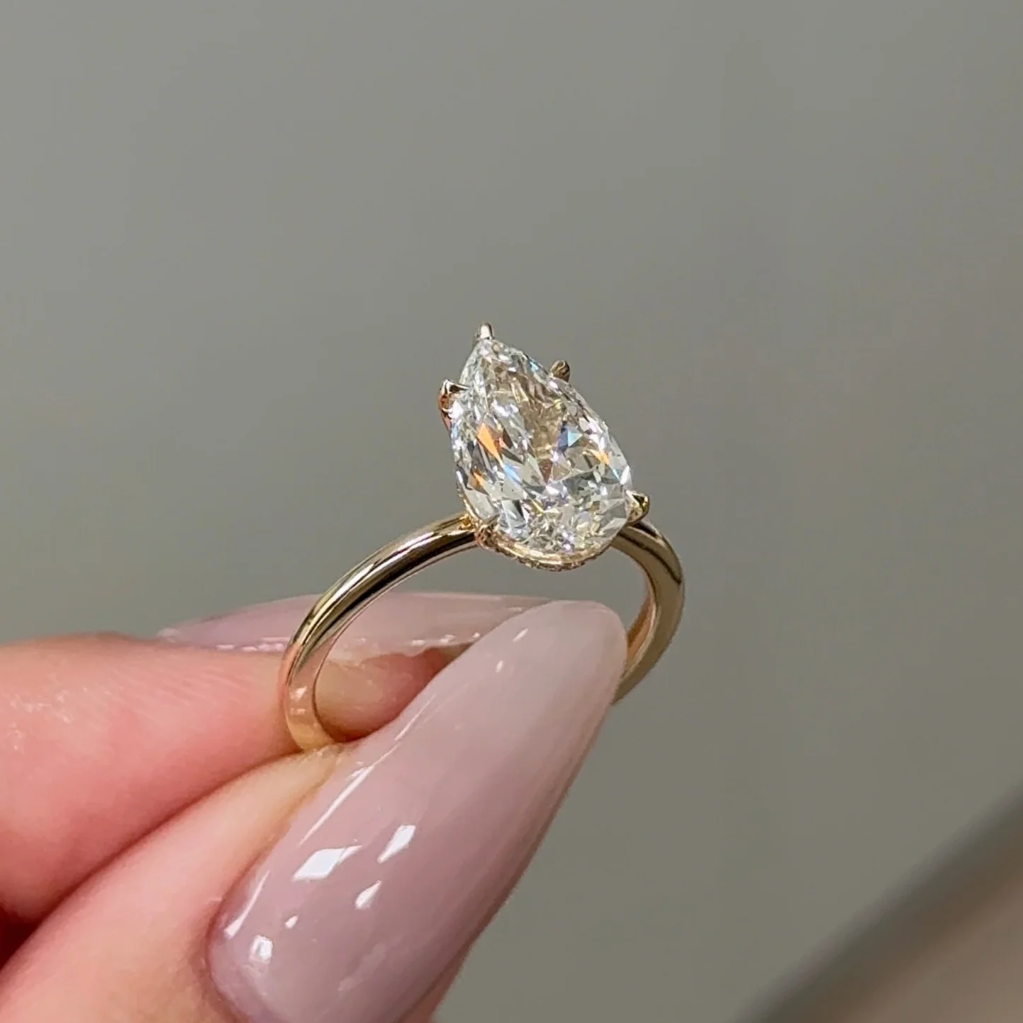 2 Carats Pear Cut Diamond Solitaire with Hidden Halo Setting