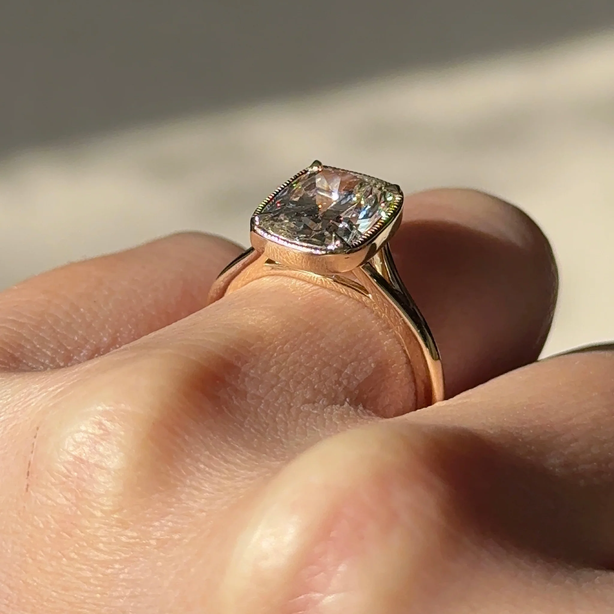 3 carats Elongated Cushion cut Tapered band with slim bezel ring