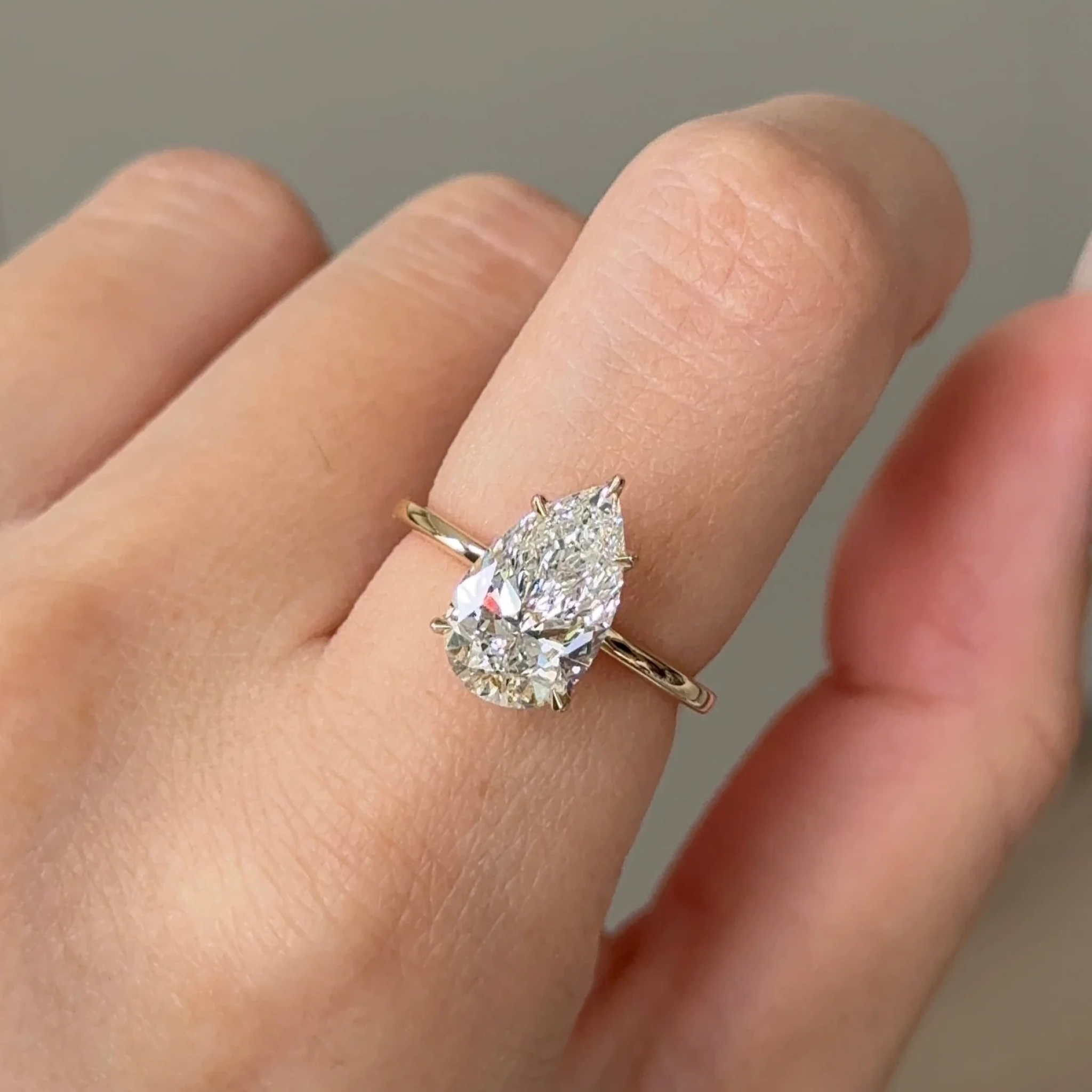 2 Carats Pear Cut Diamond Solitaire with Hidden Halo Setting