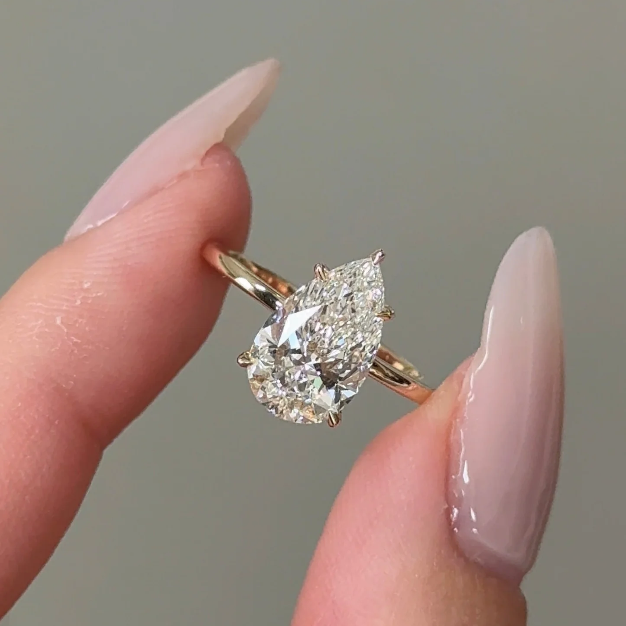 2 Carats Pear Cut Diamond Solitaire with Hidden Halo Setting