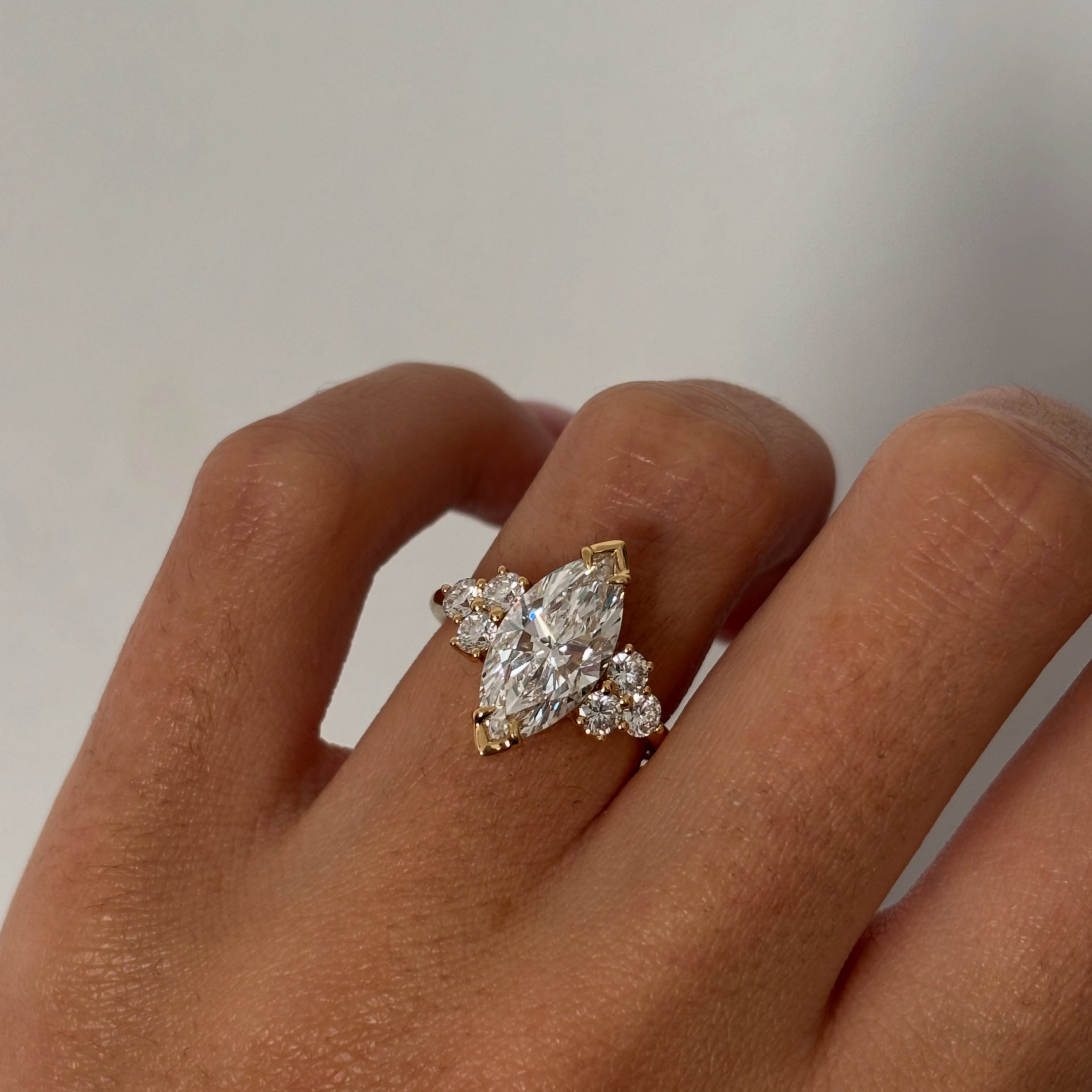 3 CT Marquise Lab Grown Diamond Engagement Ring with Round Diamond Side Cluster