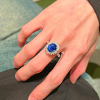 Oval Blue Sapphire & Diamond Halo Ring | Twisted Band Engagement Ring