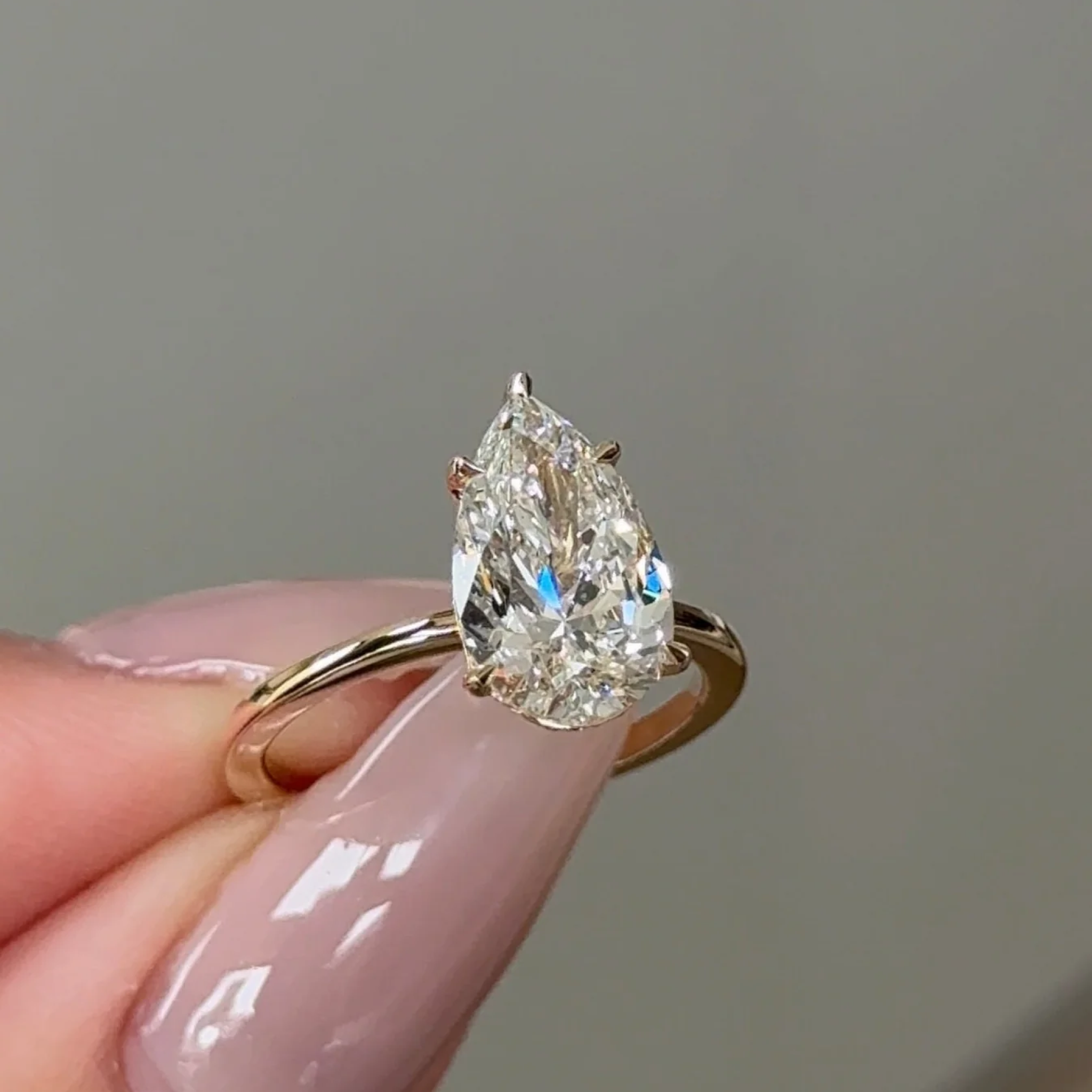 2 Carats Pear Cut Diamond Solitaire with Hidden Halo Setting