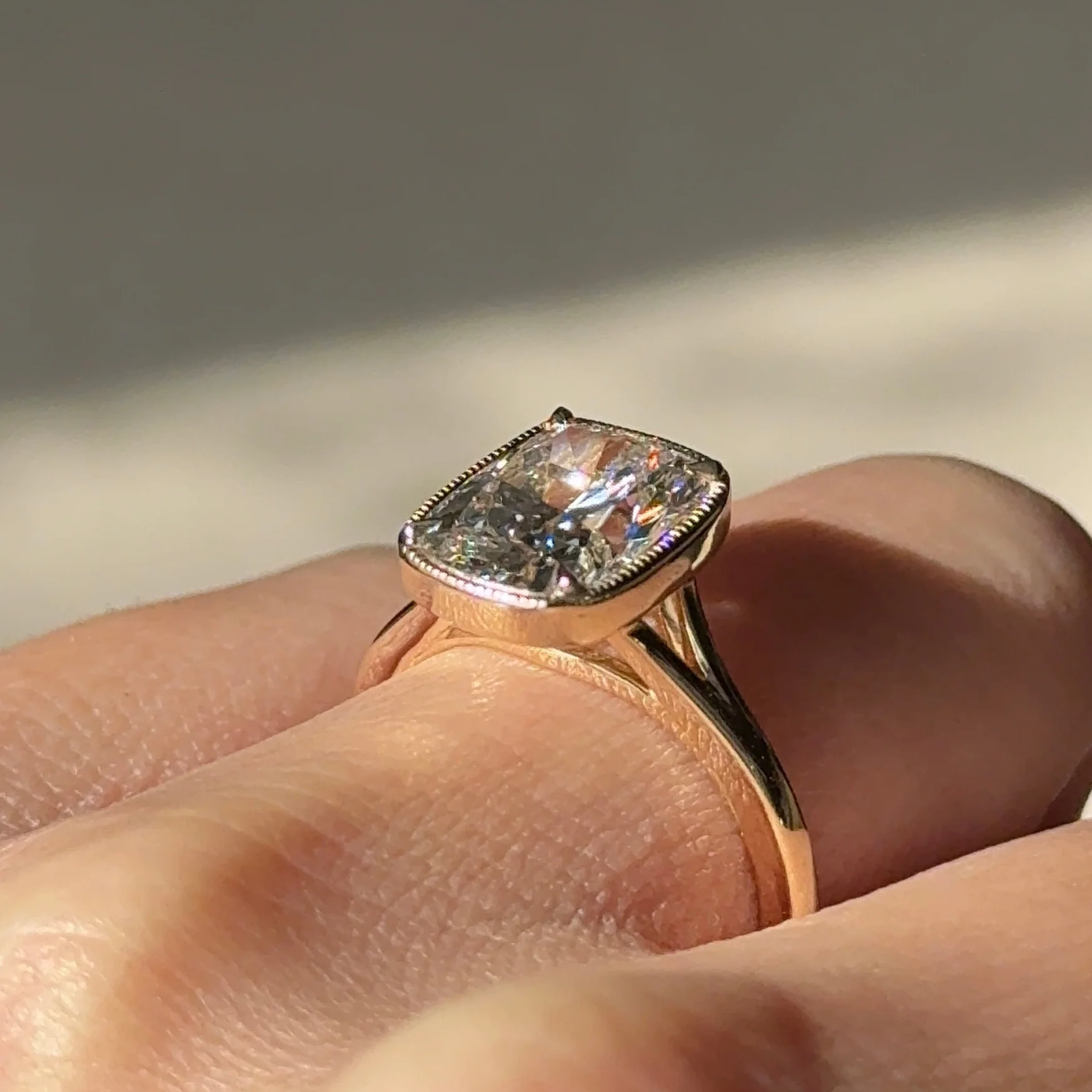 3 carats Elongated Cushion cut Tapered band with slim bezel ring