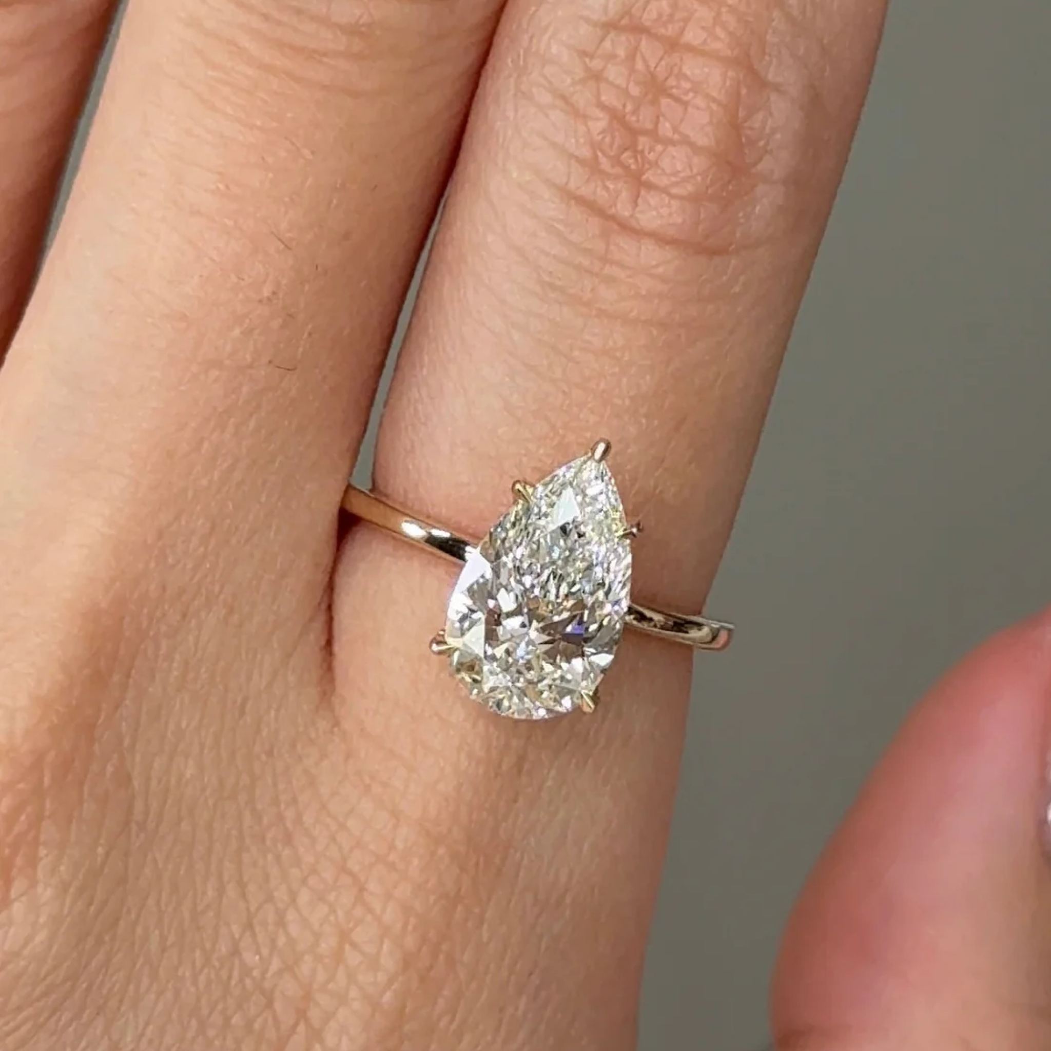 2 Carats Pear Cut Diamond Solitaire with Hidden Halo Setting
